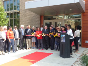 Supporters and staff cut the ribbon to open the new building.